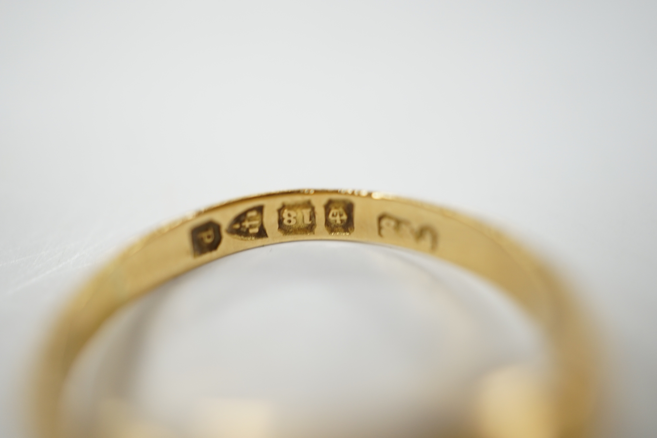 A late Victorian 18ct gold and claw set solitaire diamond ring, size P, gross weight 6.1 grams